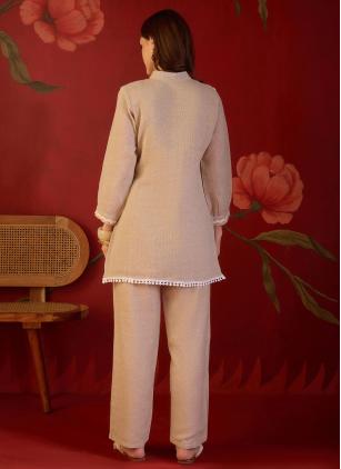 
                      Beige Embroidered Party Wear Kurti