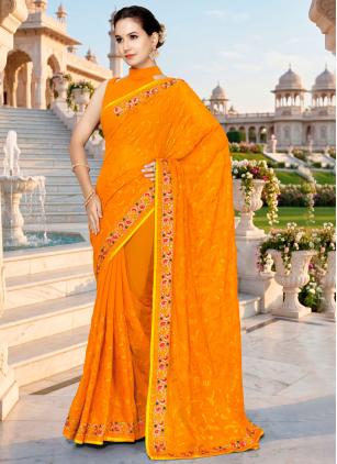 
                      Mustard Embroidered Georgette Classic Saree