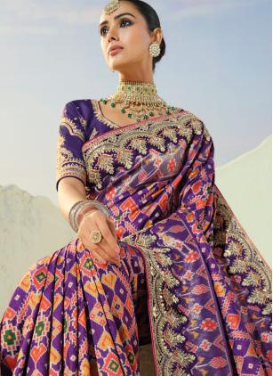
                      Purple Cut Dana Work Patola Silk Saree For Engagement